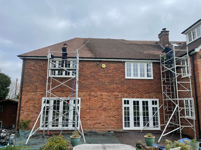 Roof cleaning carried out safely from scaffold towers by The Roof Moss Cleaners in Tring